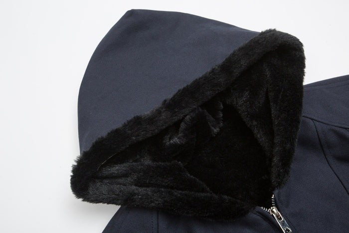 Close-up of the navy jacket hood showing its thick black plush lining and edge trim