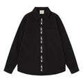 Oversized long-sleeve button-down shirt with script embroidery placket shown in black and off-white colorways