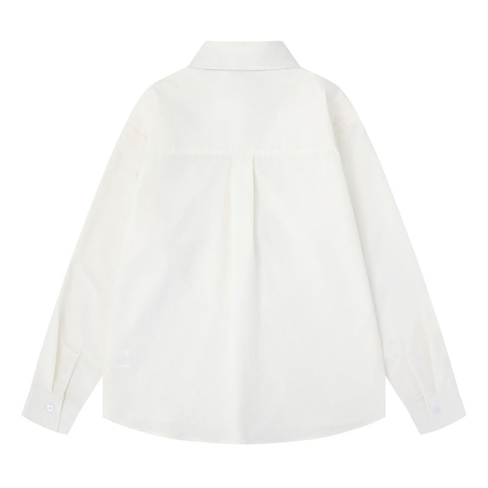 White oversized long sleeve button-down shirt back view with pleated yoke and curved hem