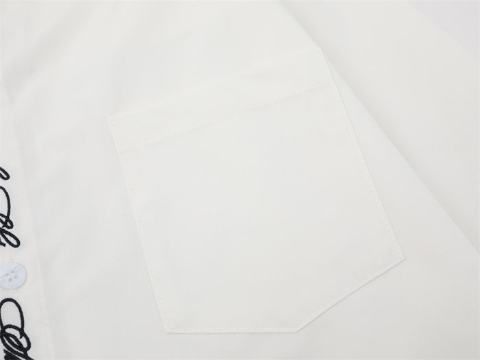 Close-up of white chest pocket on oversized button-down shirt
