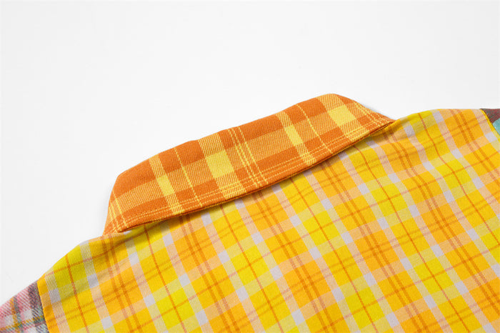 Close-up of the layered orange and yellow plaid collar and upper shirt panels