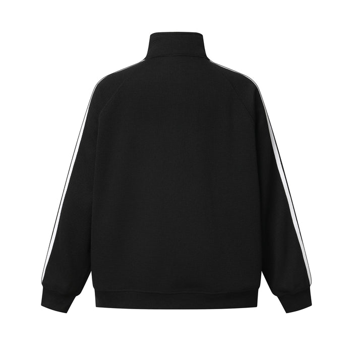 Back view of the black track jacket with white sleeve stripes and a plain textured body