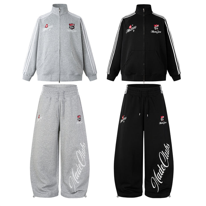 Retro three-stripe track jacket and wide-leg sweatpants set in black and heather gray with embroidered Ma1999 badge and cursi