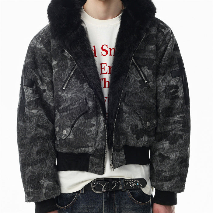 Front model view of a dark rose-patterned bomber jacket with black faux fur collar, zippers and ribbed cuffs