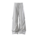 Light gray wide-leg sweatpants front view with pleated sculpted panels and drawstring waist