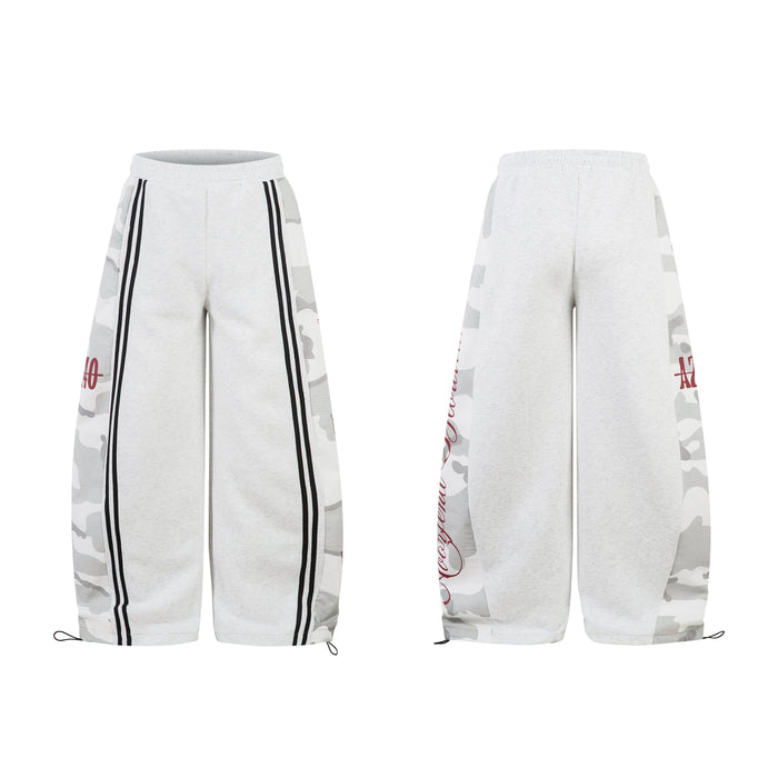Front and back view of light grey wide-leg sweatpants with white camo side panels, black stripes and red script lettering