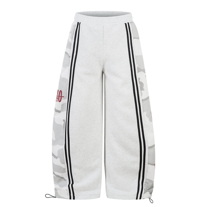 Front view of light gray wide-leg sweatpants with black side stripes and camo side panels