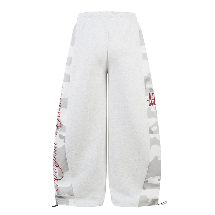 Back view of light gray wide-leg sweatpants with camo side panels and red script graphics