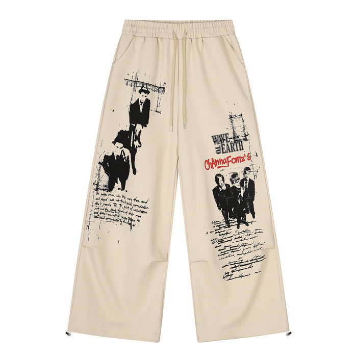 Beige wide-leg pants with black graphic figures and red text, front view