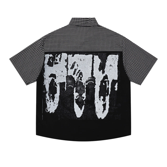 Black and white plaid button-up shirt with oversized graphic print on the back, short sleeves, and streetwear style