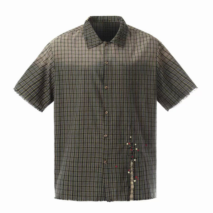 Distressed plaid short-sleeve shirt with raw edges and star embroidery on a dark check pattern