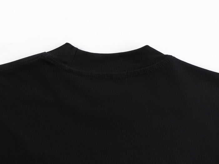 Black oversized graphic tee with a ribbed crew neck and visible seam detailing against a white background