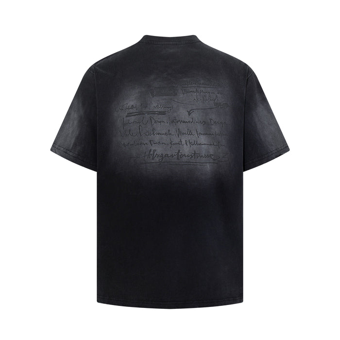 Black washed graphic tee with faded handwritten back print and vintage distressed finish
