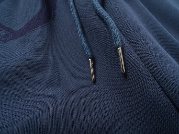 Close-up of blue drawstring ends on the sweatpants waistband