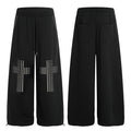 Black wide-leg sweatpants with square metal stud cross motifs on each leg, front and back view