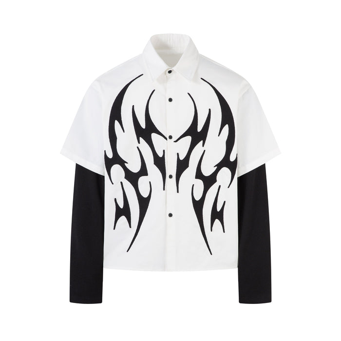 White button-up shirt with black tribal flame graphic and black layered long sleeves, front view