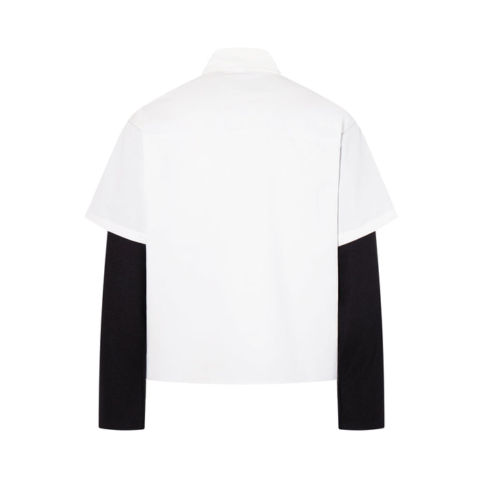 Back view of white layered shirt with black long sleeves and plain back panel
