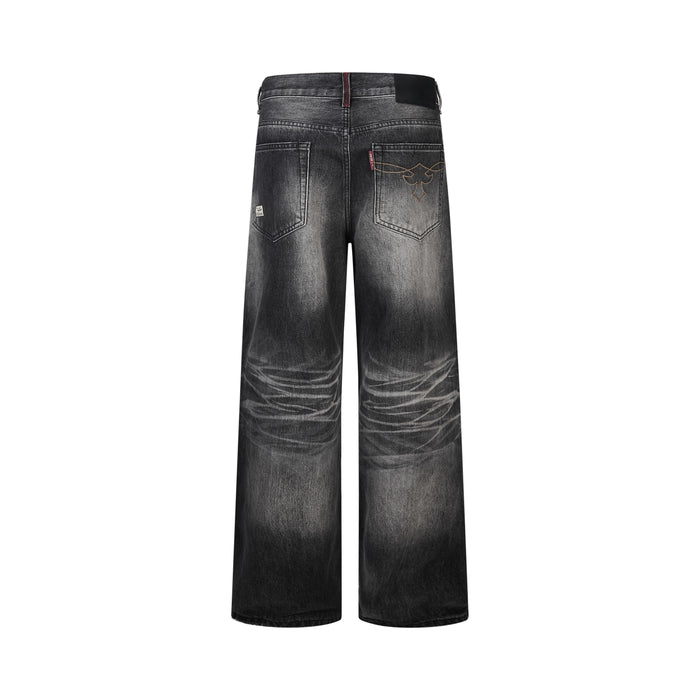Back view of dark charcoal wide-leg jeans with faded knees and stitched back pockets