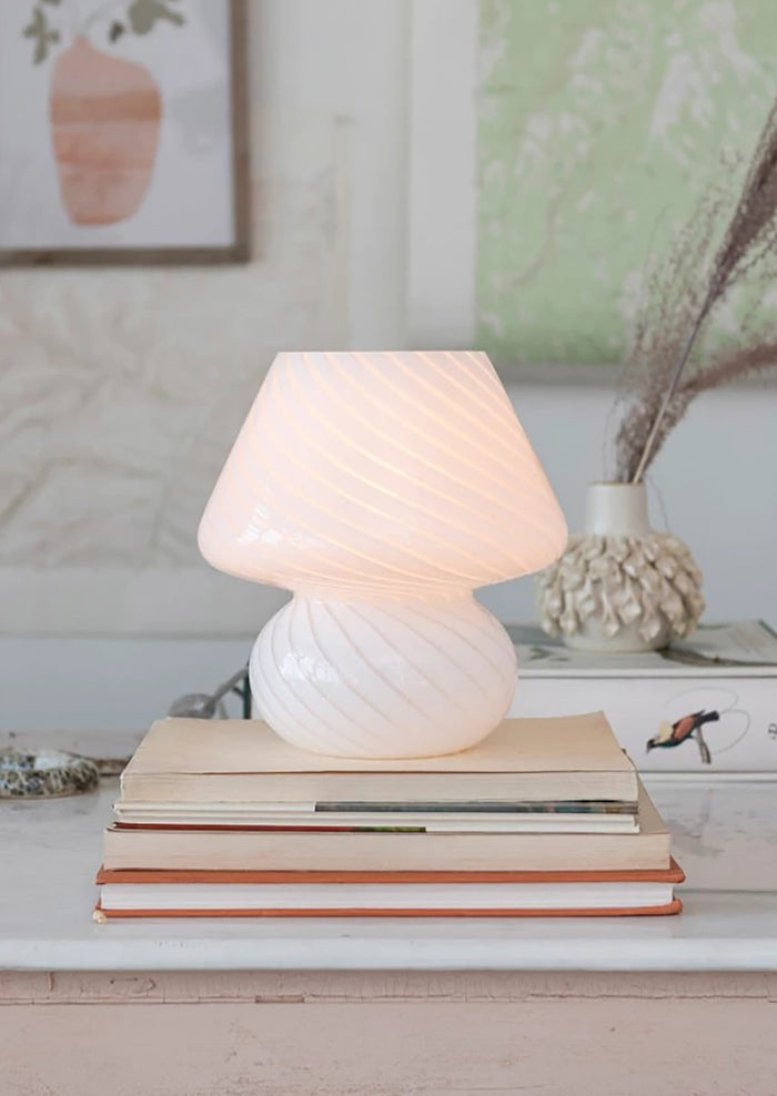 A white art glass table lamp with white/clear spiral pattern.
