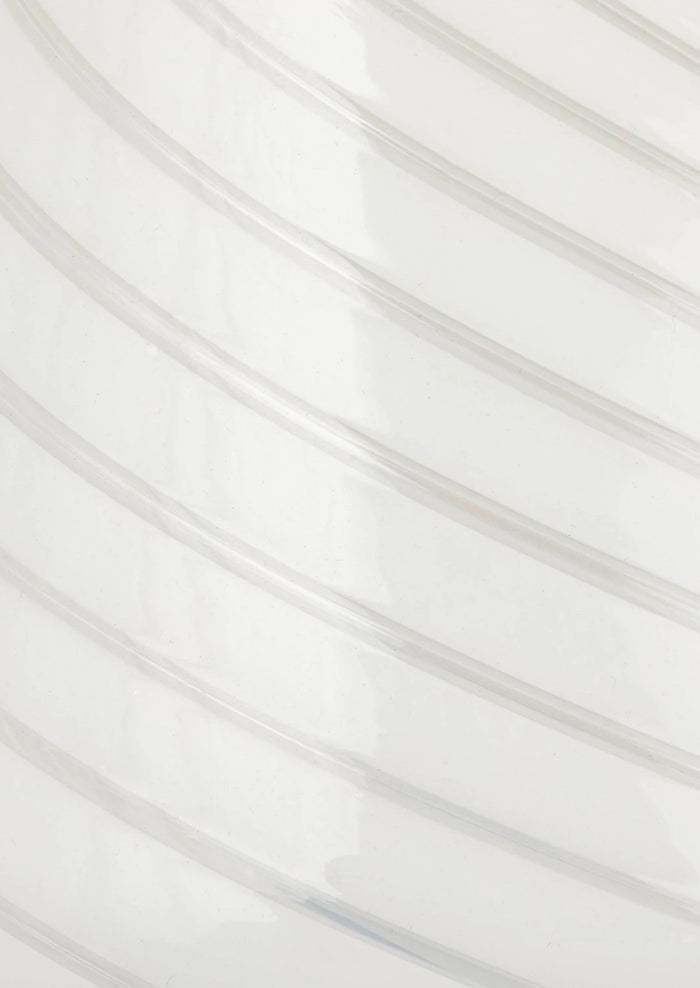 A white art glass table lamp with white/clear spiral pattern.