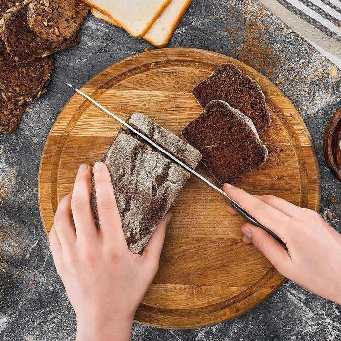 Stainless steel kitchen bread knife with serrated blade.