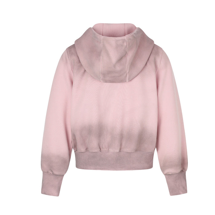 Back view of the pink zip-up hoodie showing its plain body, hood, long sleeves and ribbed hem