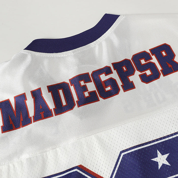White retro football jersey with purple trim, bold MADEGPSR lettering, and star graphic on breathable mesh fabric