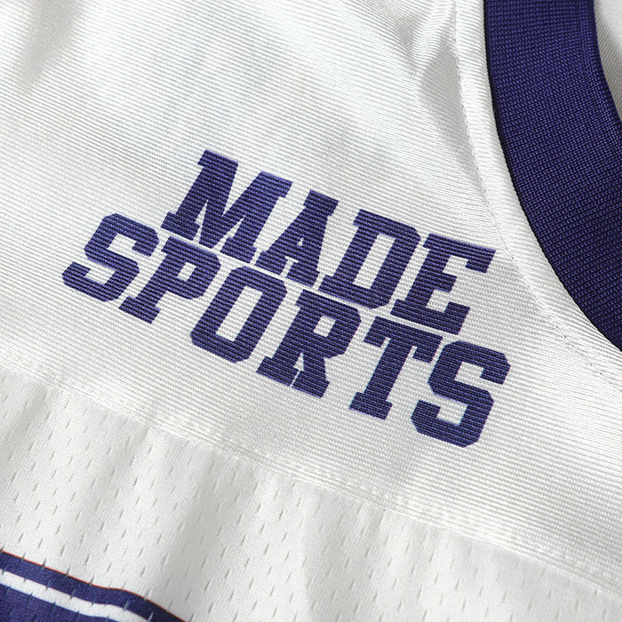 Close-up of a white and purple retro football jersey with MADE SPORTS lettering and mesh fabric detail