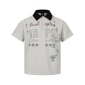 Black and white striped polo shirt with rhinestone letter and star graphic on chest, contrast black collar, short sleeve