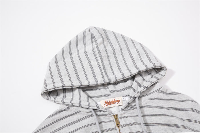 Close-up of the light gray striped hoodie hood, drawstrings, collar, and upper zipper