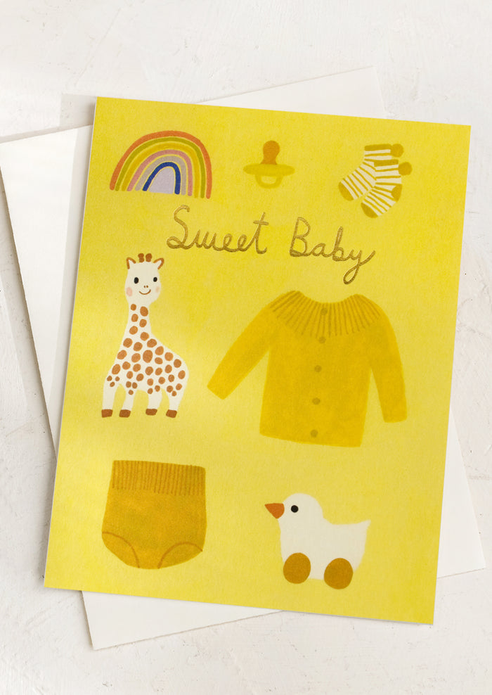 An illustrated greeting card in tones of yellow reading "Sweet baby".