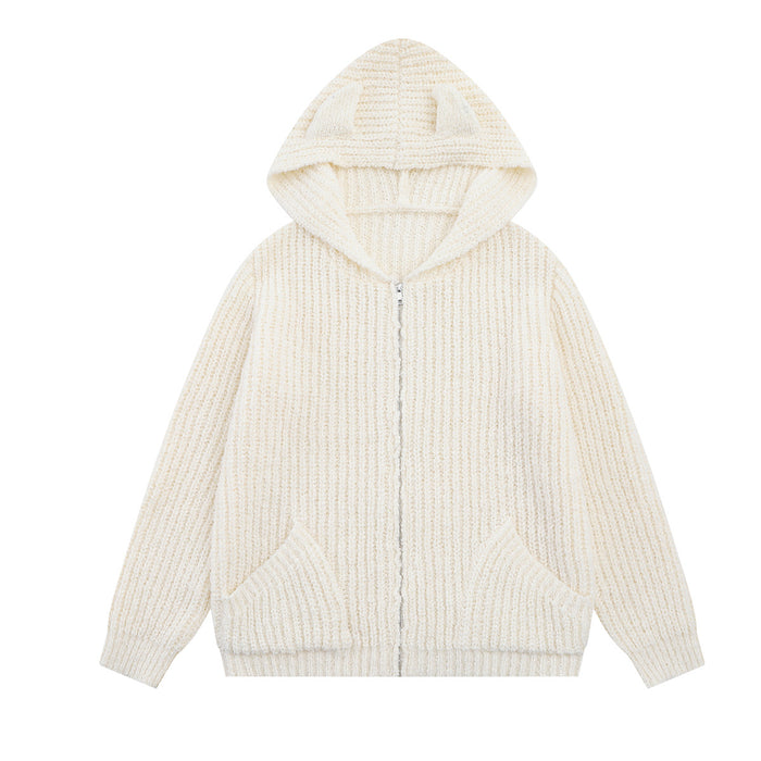 Cream knit zip-up hoodie with bear-ear hood, front pockets, long sleeves, and ribbed hem