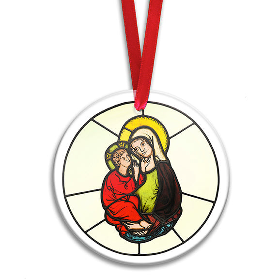 A round stained glass ornament featuring the Virgin Mary and the Christ child, with a red satin ribbon at the top for hanging.