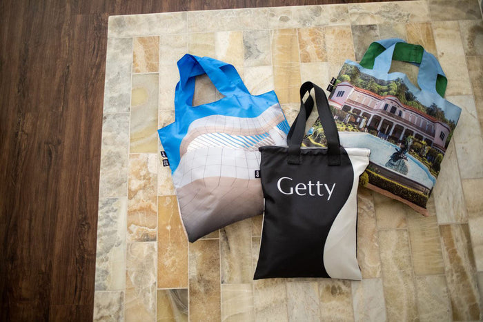 3 Totes on a marbled surface including one that says Getty