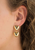 Two stacked hearts earrings in gold.