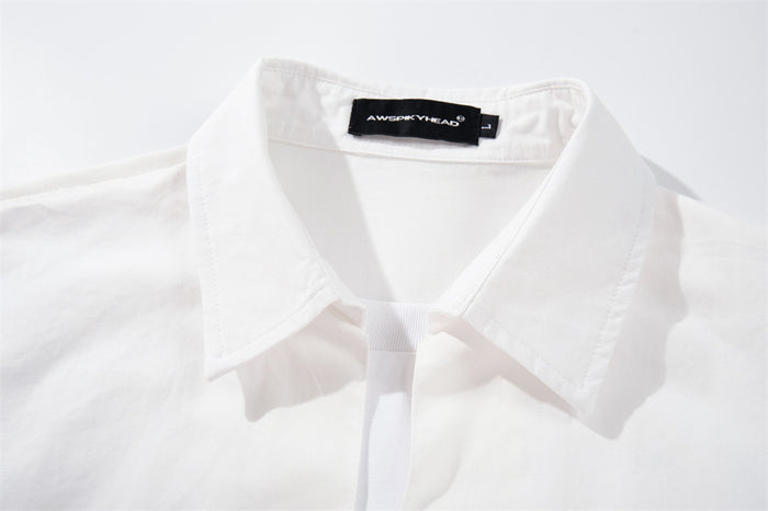 White shirt collar and faux layered neckline close-up