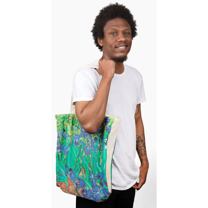 Model holding Van Gogh Irises Canvas Tote Bag