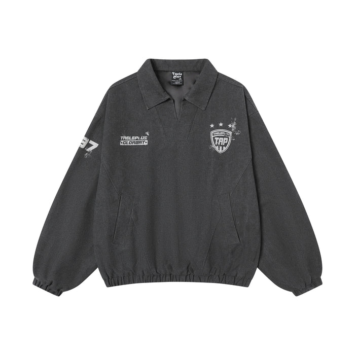 Front view of the charcoal pullover training jacket with polo collar, white chest graphics, and elastic cuffs