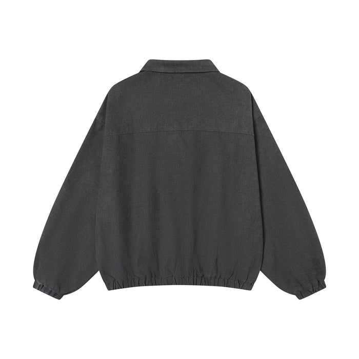 Back view of the charcoal pullover training jacket showing the plain washed fabric and elastic hem