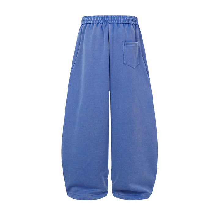 Blue wide-leg sweatpants shown from the back with an elastic waistband and single stitched back pocket