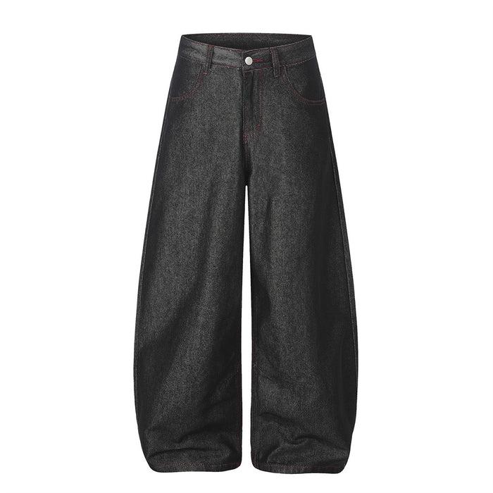Front view of black wide-leg barrel jeans with curved legs and red stitching