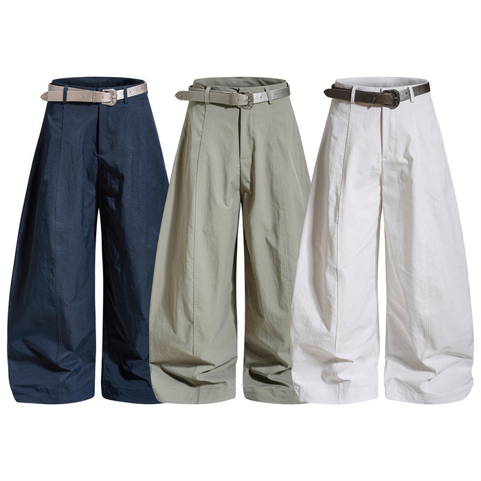 Wide-leg trousers in navy, sage green, and white with high waists and matching belts