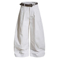 White wide-leg barrel trousers shown from the front with a dark buckle belt