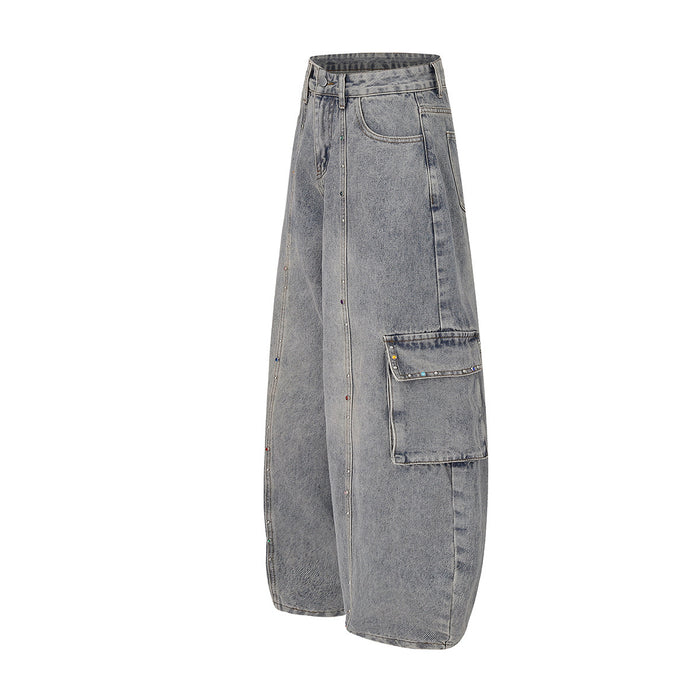 Side view of gray wide-leg cargo jeans showing a large flap cargo pocket and rhinestone seam detail