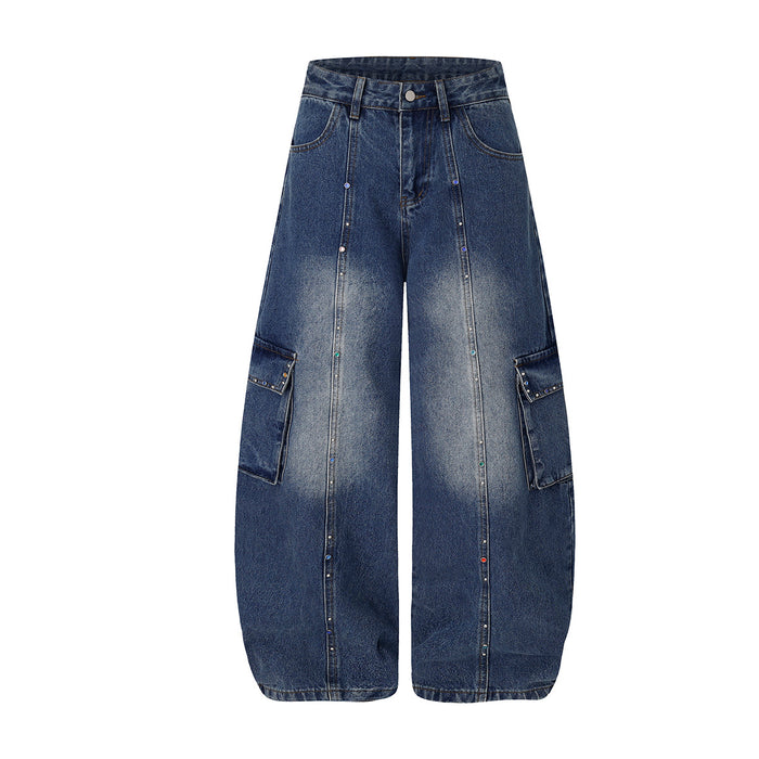 Front view of dark blue wide-leg cargo jeans with rhinestone-accented seams and flap cargo pockets