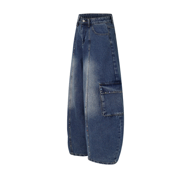 Side view of dark blue wide-leg cargo jeans showing the large flap cargo pocket and relaxed leg shape