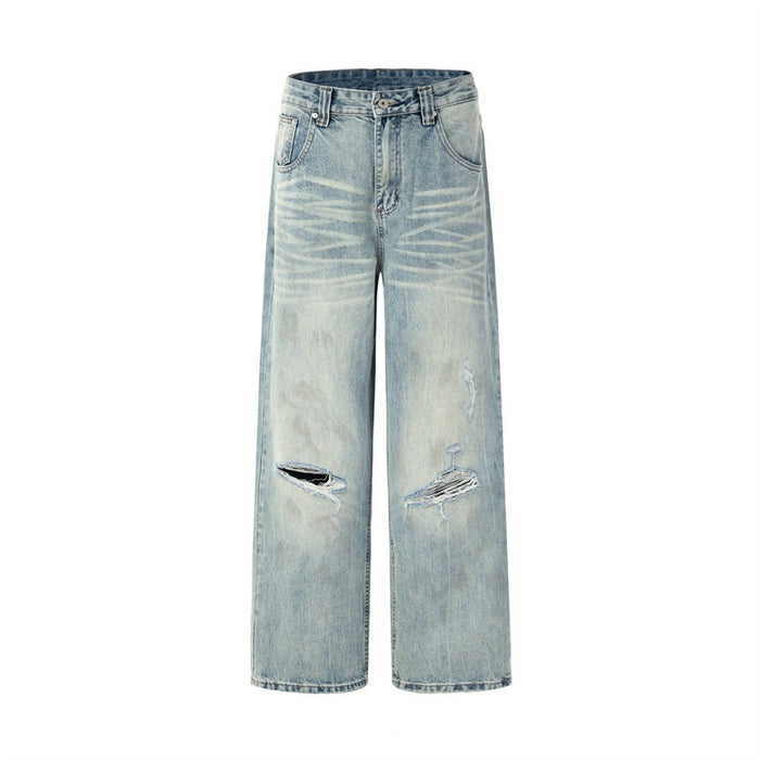 Front flat lay of light-wash wide-leg jeans with whiskering and distressed knee openings