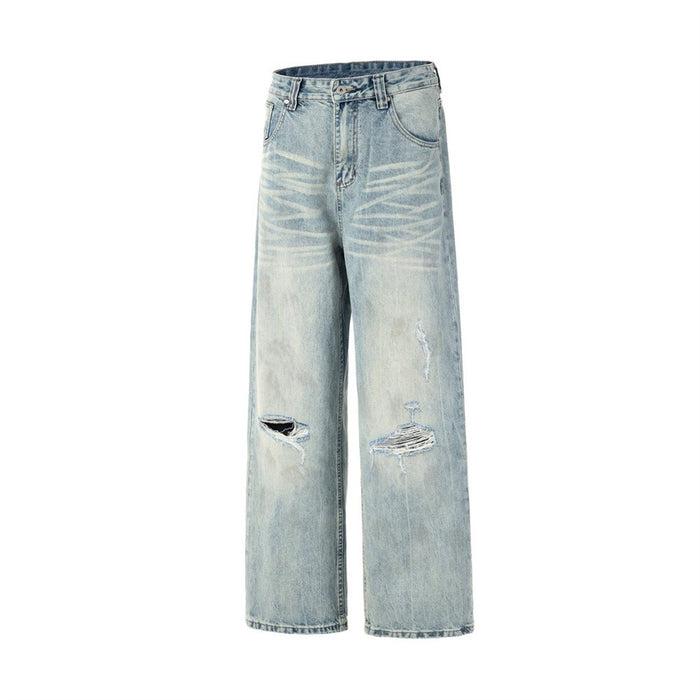 Angled front flat lay of light-wash wide-leg jeans with wide legs and ripped knees