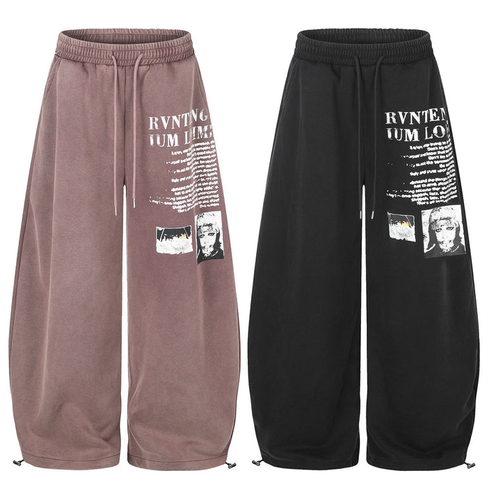 Wide-leg sweatpants in mauve and black with white graphic letter print, front view