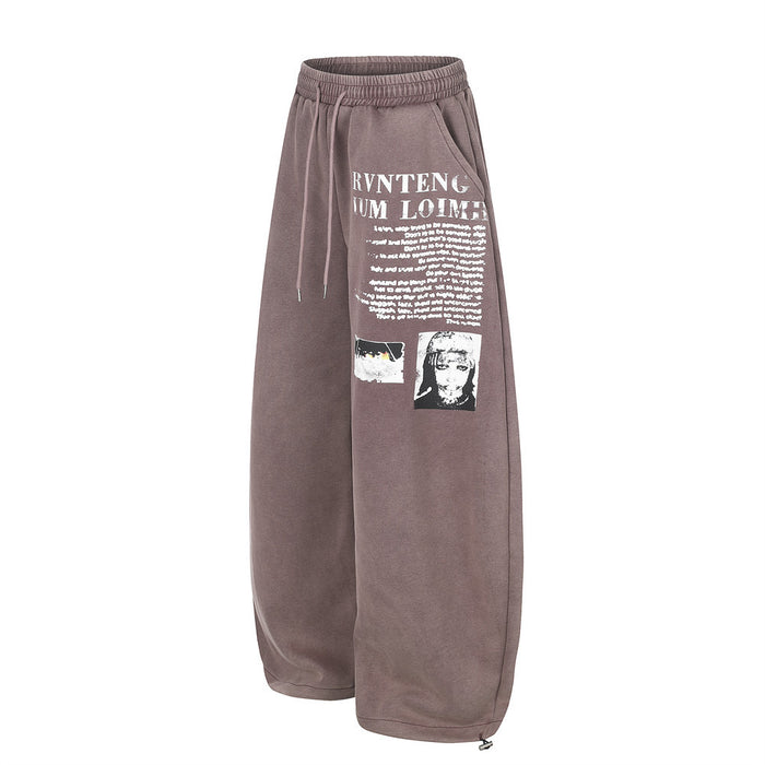 Mauve wide-leg sweatpants with white graphic letter print, angled front view
